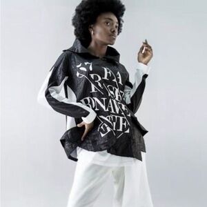 Black and white funnel neck top